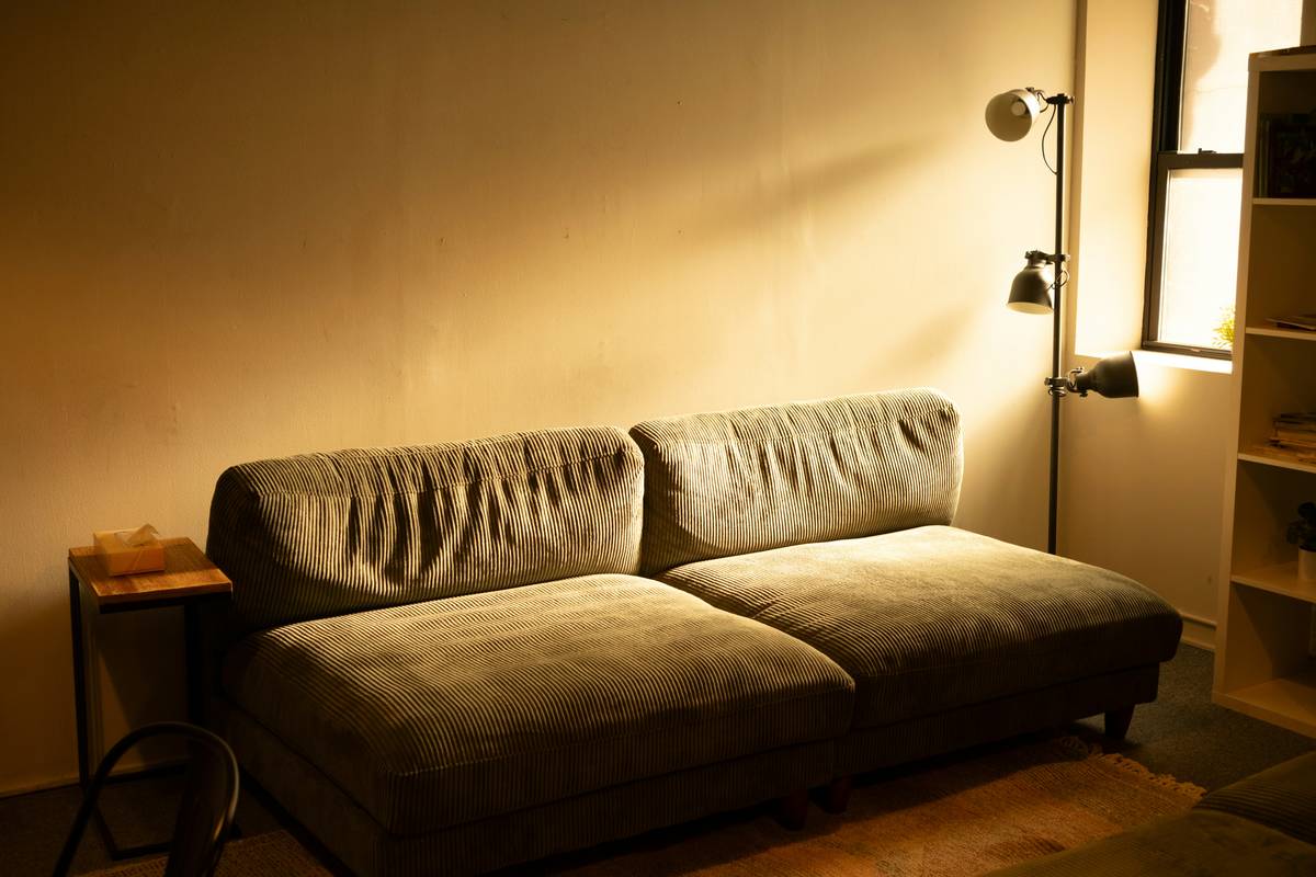 Bedroom showcasing updated mood lighting ideas with warm cove lights and textured accent spots