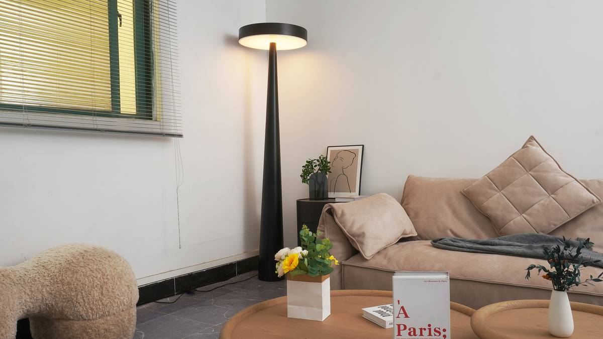 Bedroom setup showcasing updated mood lighting for relaxation with tunable white sconces and hidden cove lighting