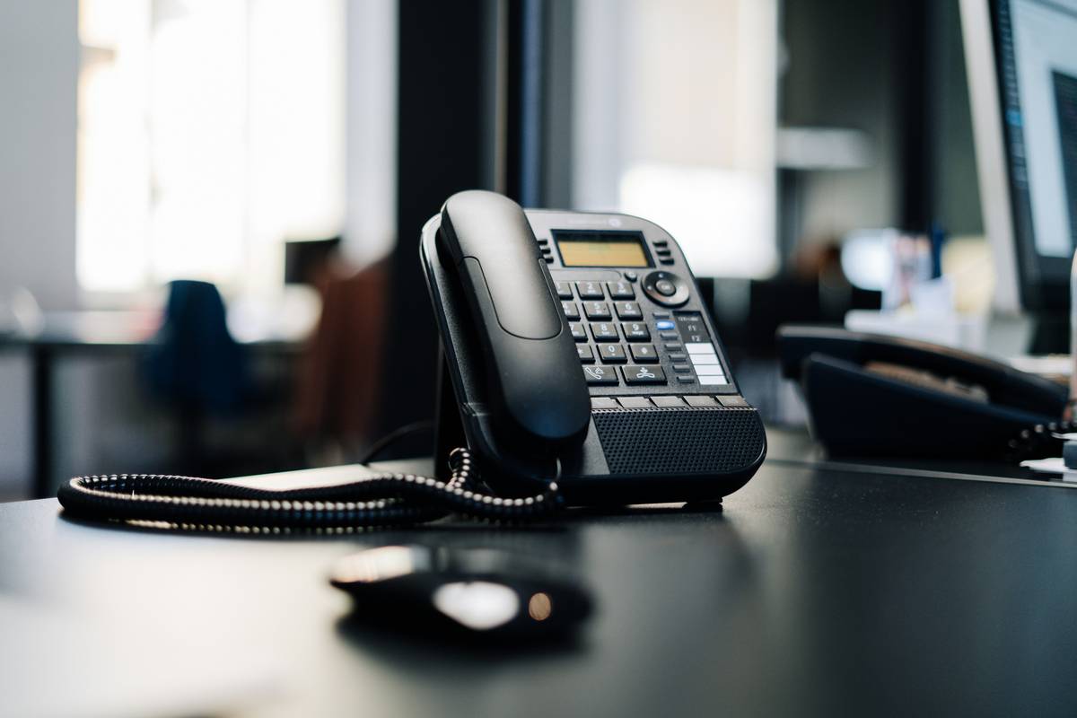 hosted pbx explained diagram showing cloud servers replacing office phone hardware